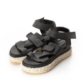 Folded black leather sandals