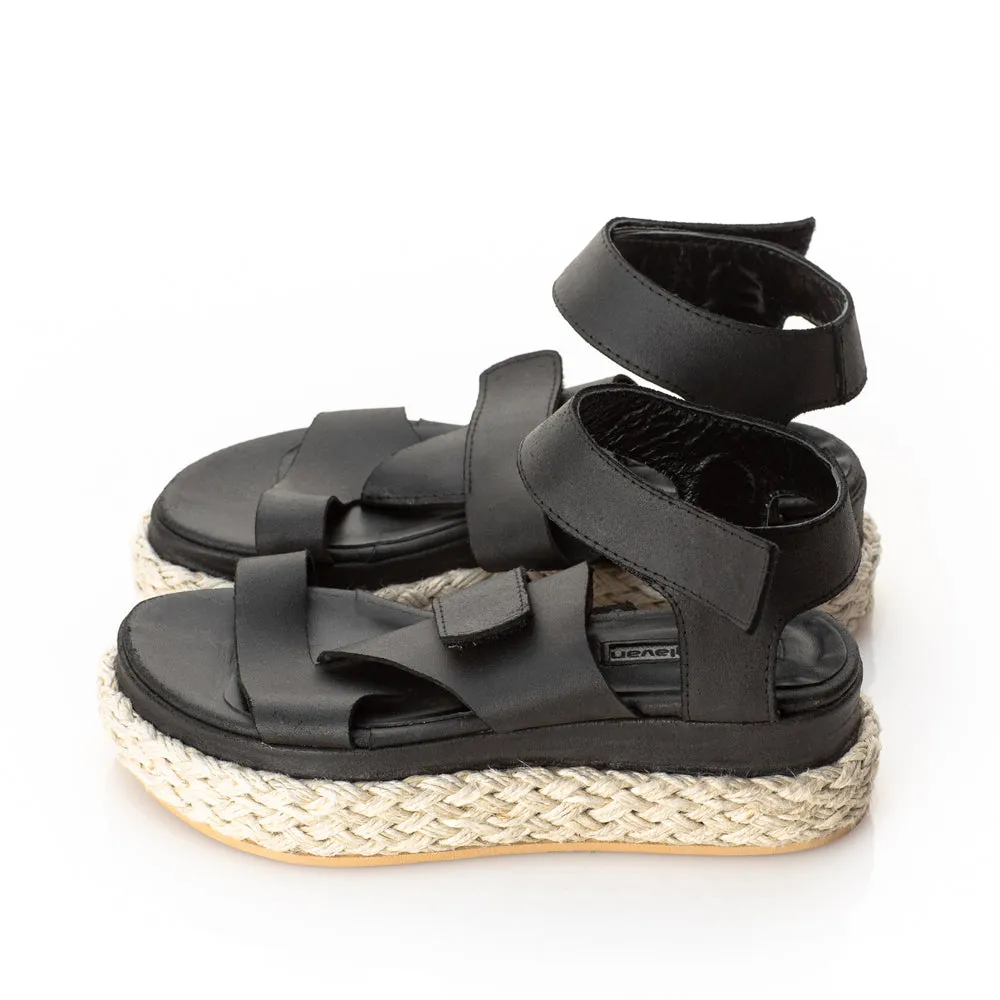 Folded black leather sandals